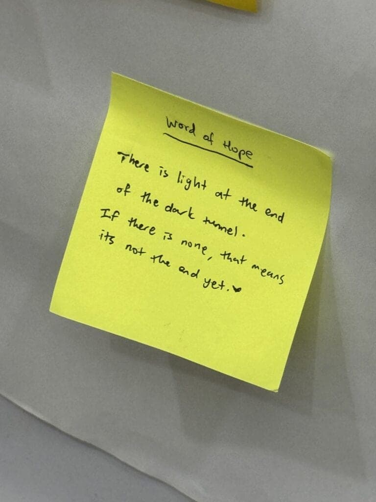 A handwritten sticky note from a Safe Space workshop